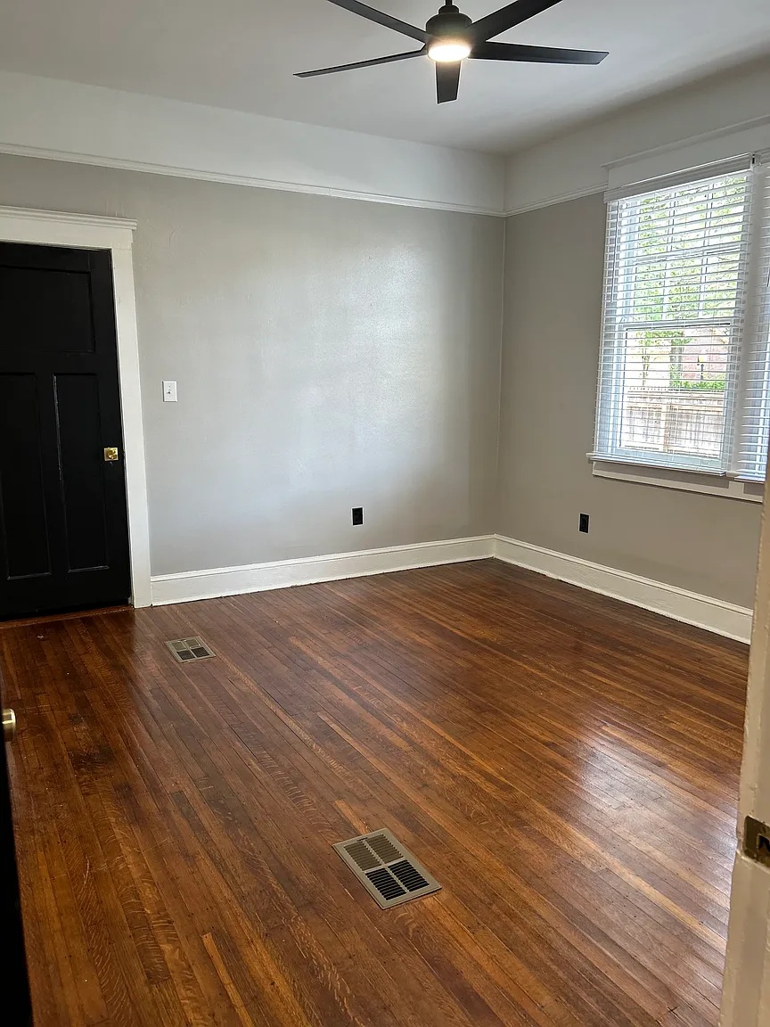 Second bedroom with ceiling fan and natural light